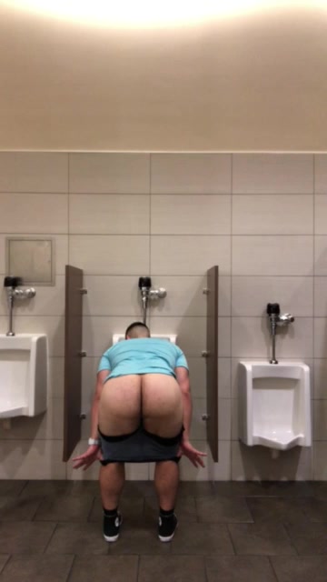 Pants down at the urinal