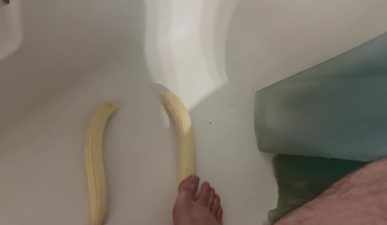 Locked chastity boy crushes bananas