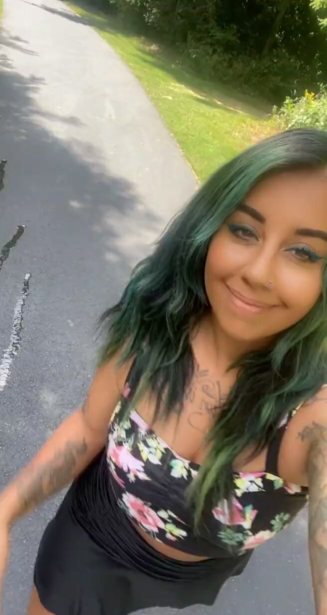 Beautiful green hair babe shows her piss puddle