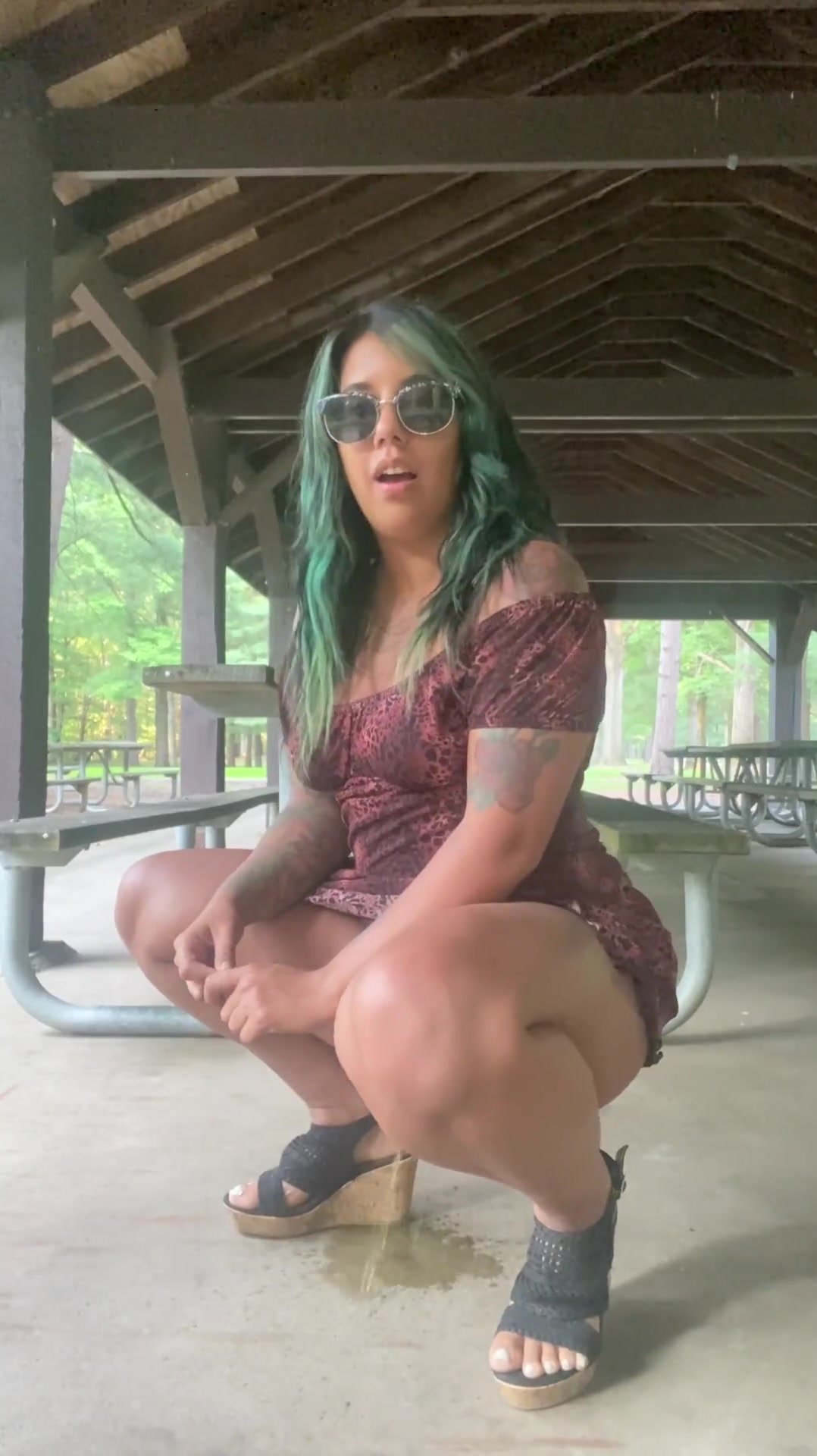 Sexy  green hair babe squat pees in the park