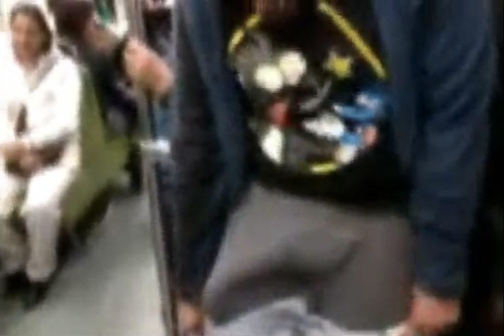Guy pulls down his pants on the subway