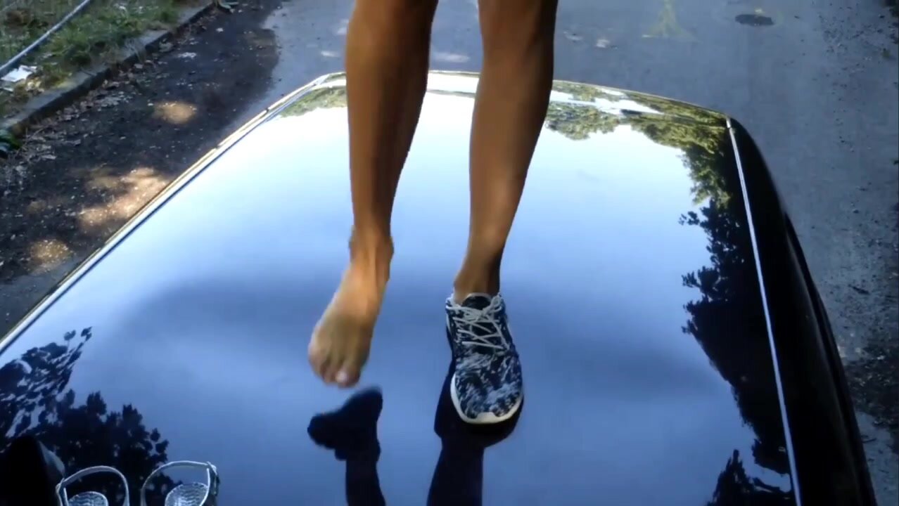 Girl trampling car roof