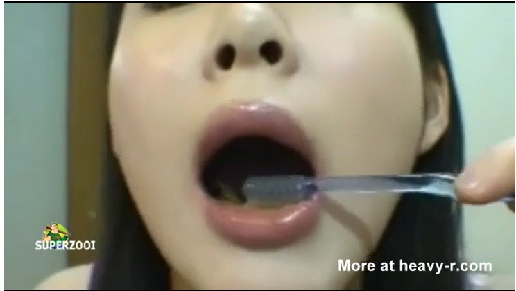 A cute Japanese girl brashing her tooth