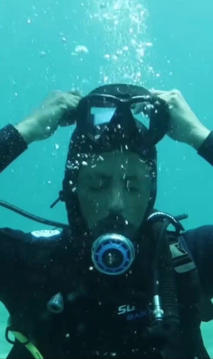 Underwater scubadiver mask removal in sea
