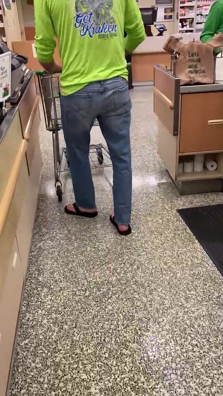 Sexy guy in long pants and flops at Publix