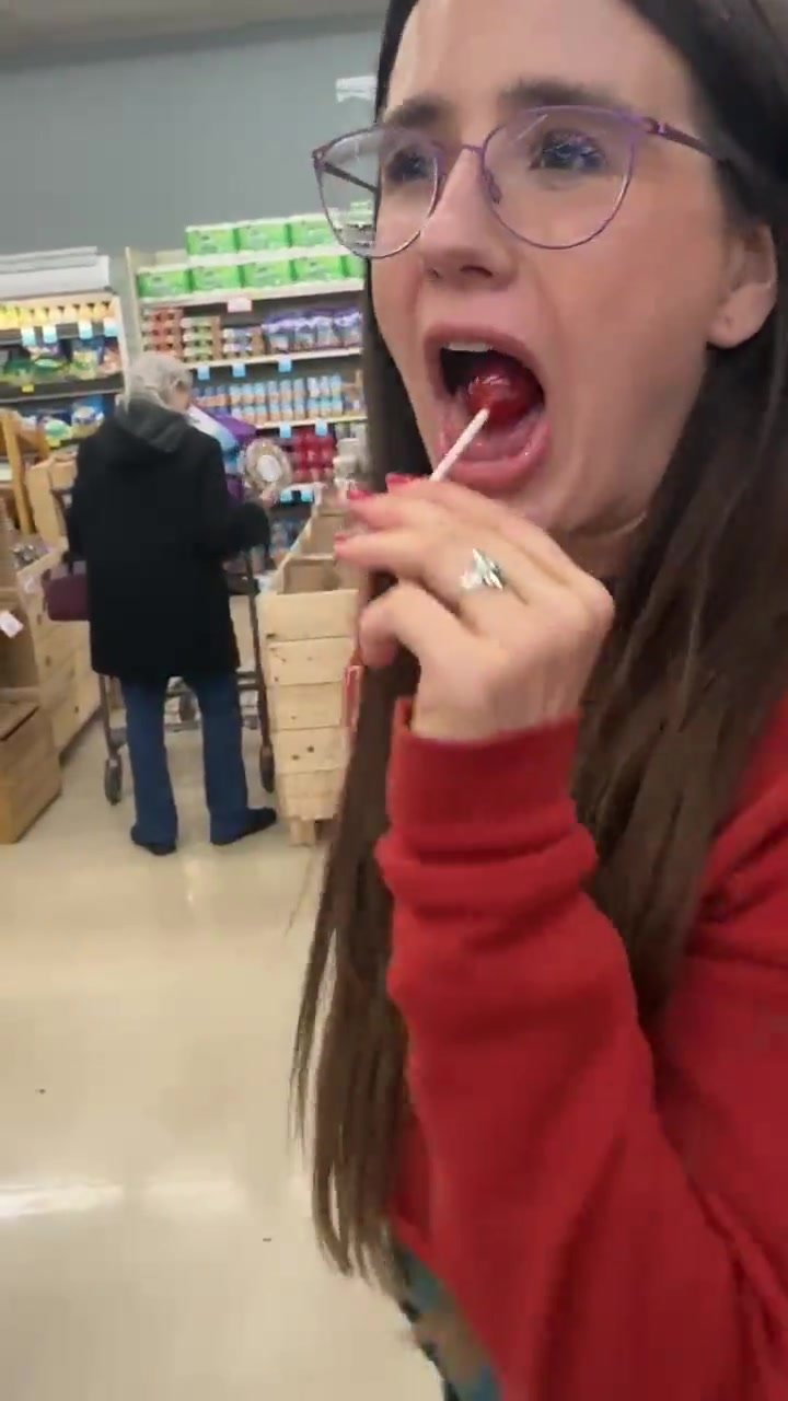 Girl pulls a lollipop from her anus, sucks it in store