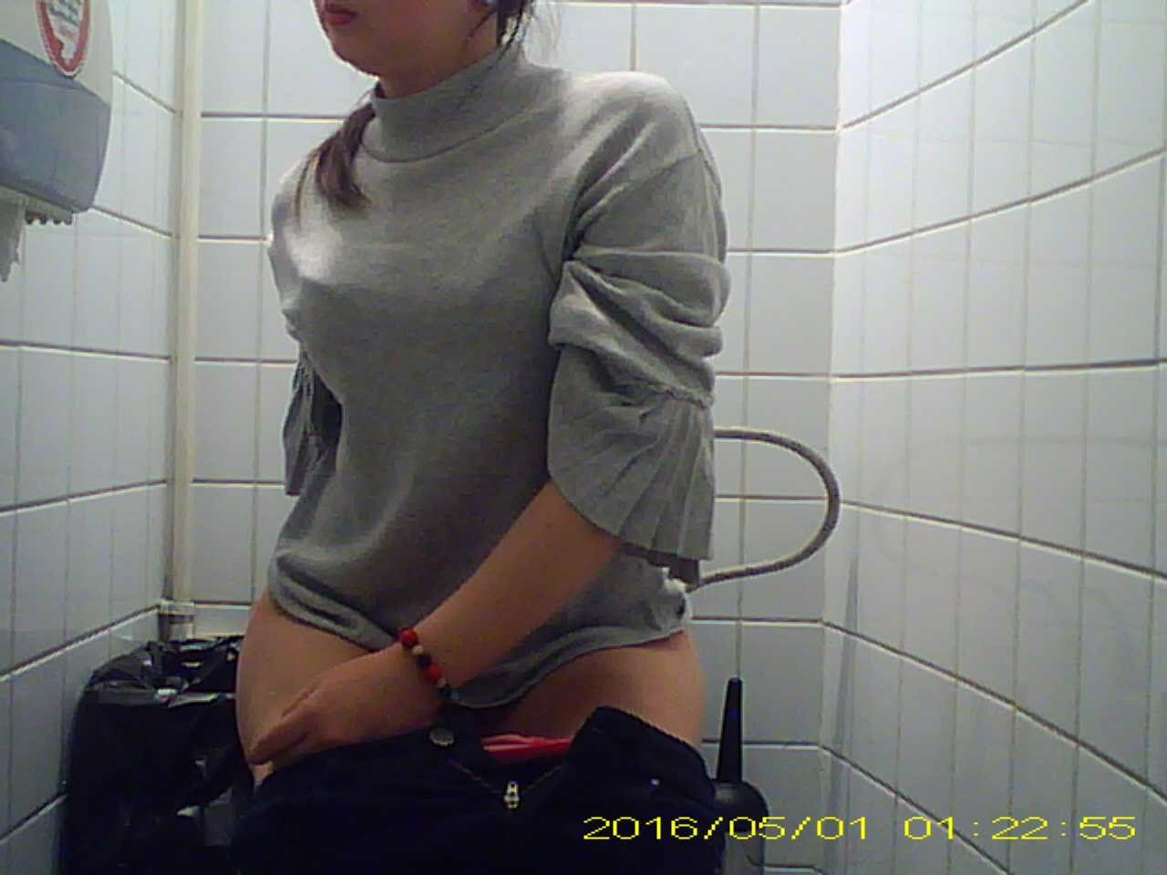 Girl pooping in stall