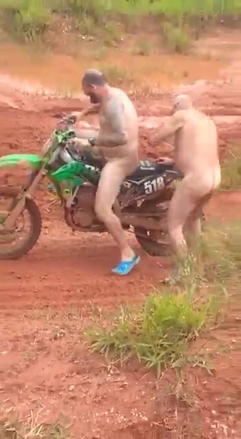 Two Naked Men Rides a Bike