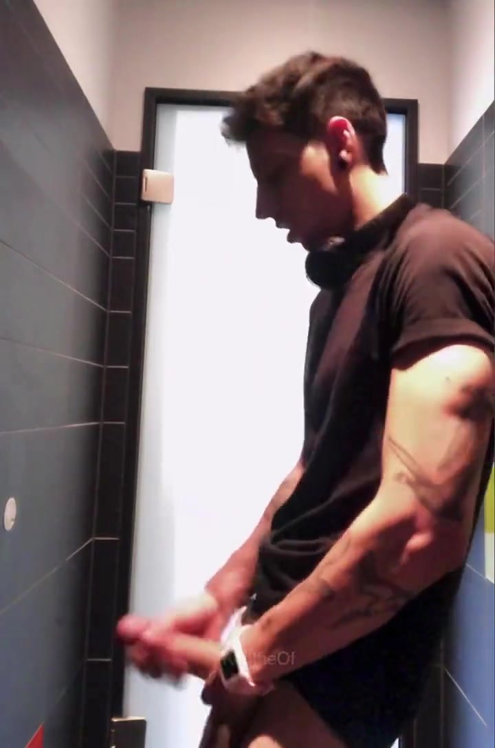 Hot guy with tattoos jerking his big cock