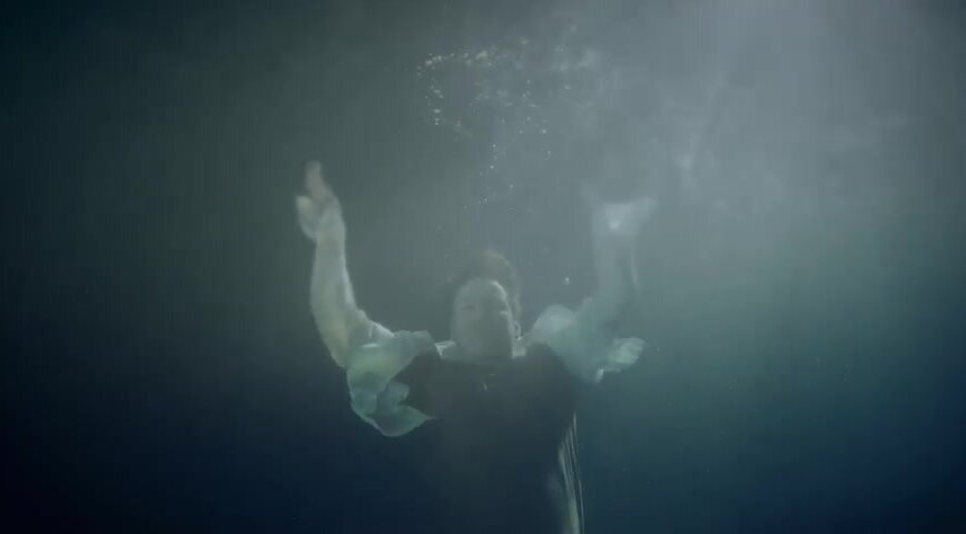 Brian clothed and barefaced underwater
