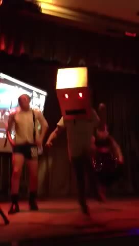 Guy dances on stage in boxers