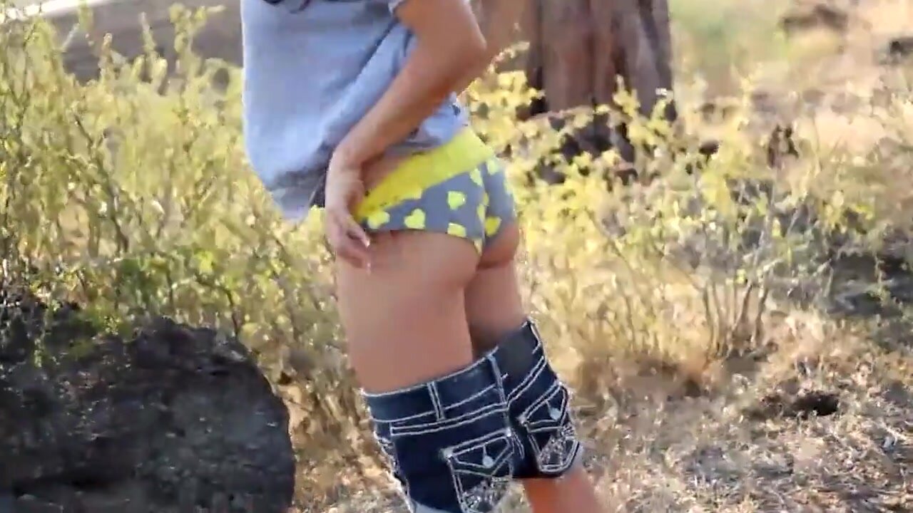 Cute butt drops undies, pees in nature on a windy day