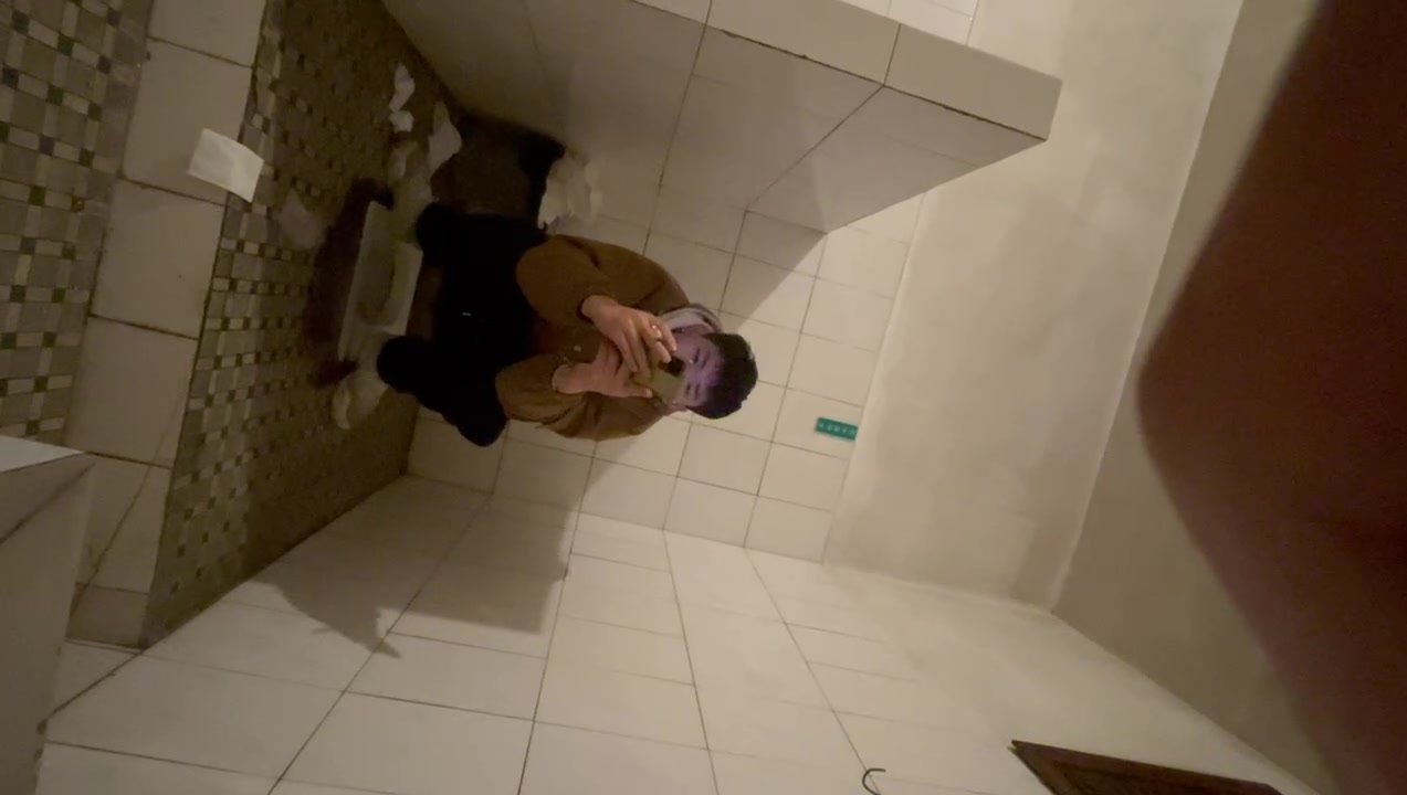 Chinese man shit in doorless toilet