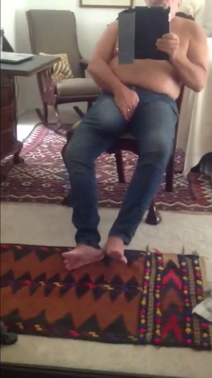 Massaging huge ballsack through jeans