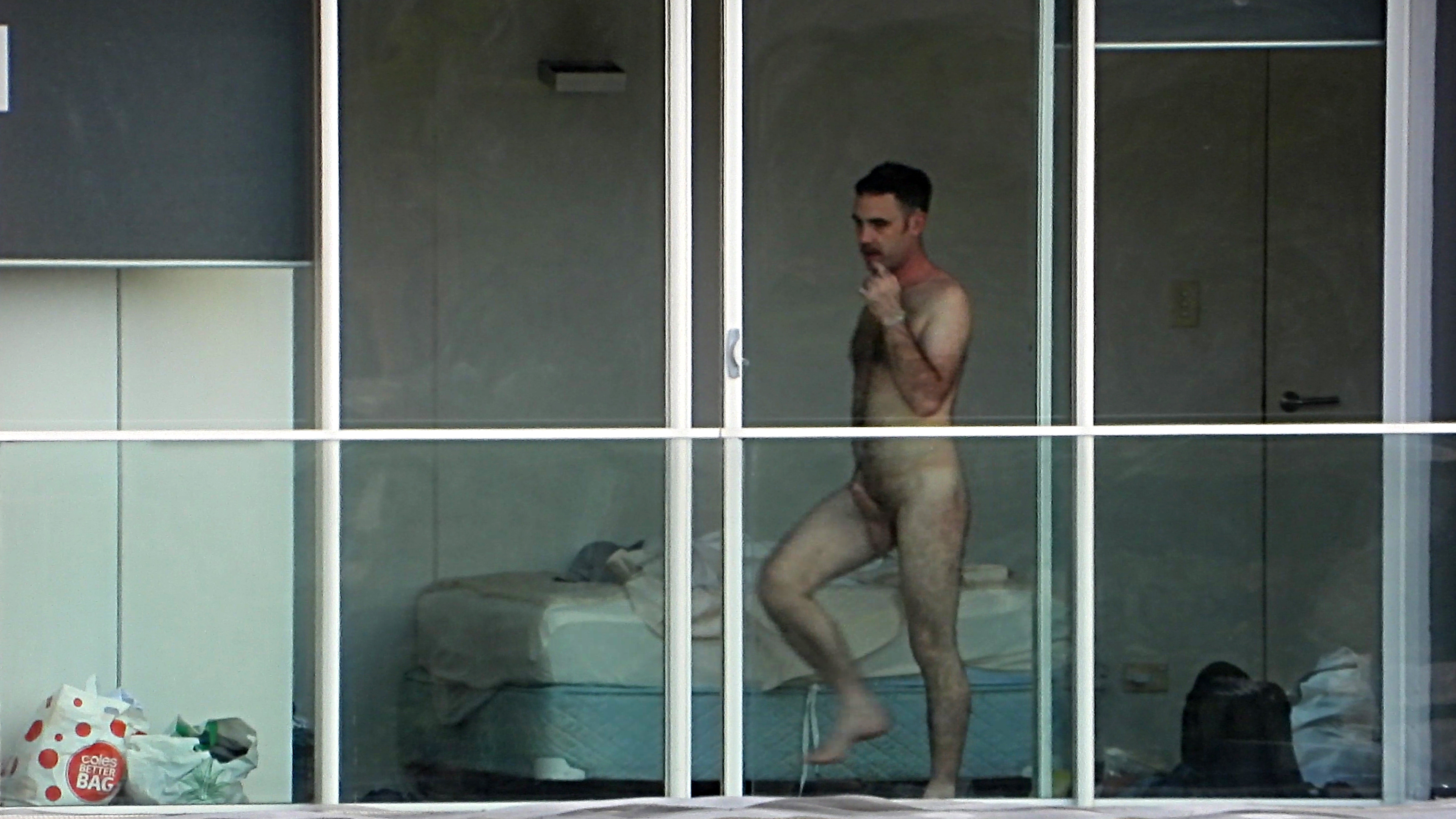 man naked voyeur window