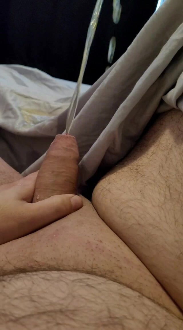 Young uncut teen cock pisses on bed