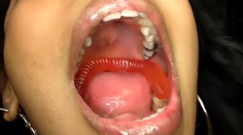 Girl Swallow Gummy With Open Mouth - video 2