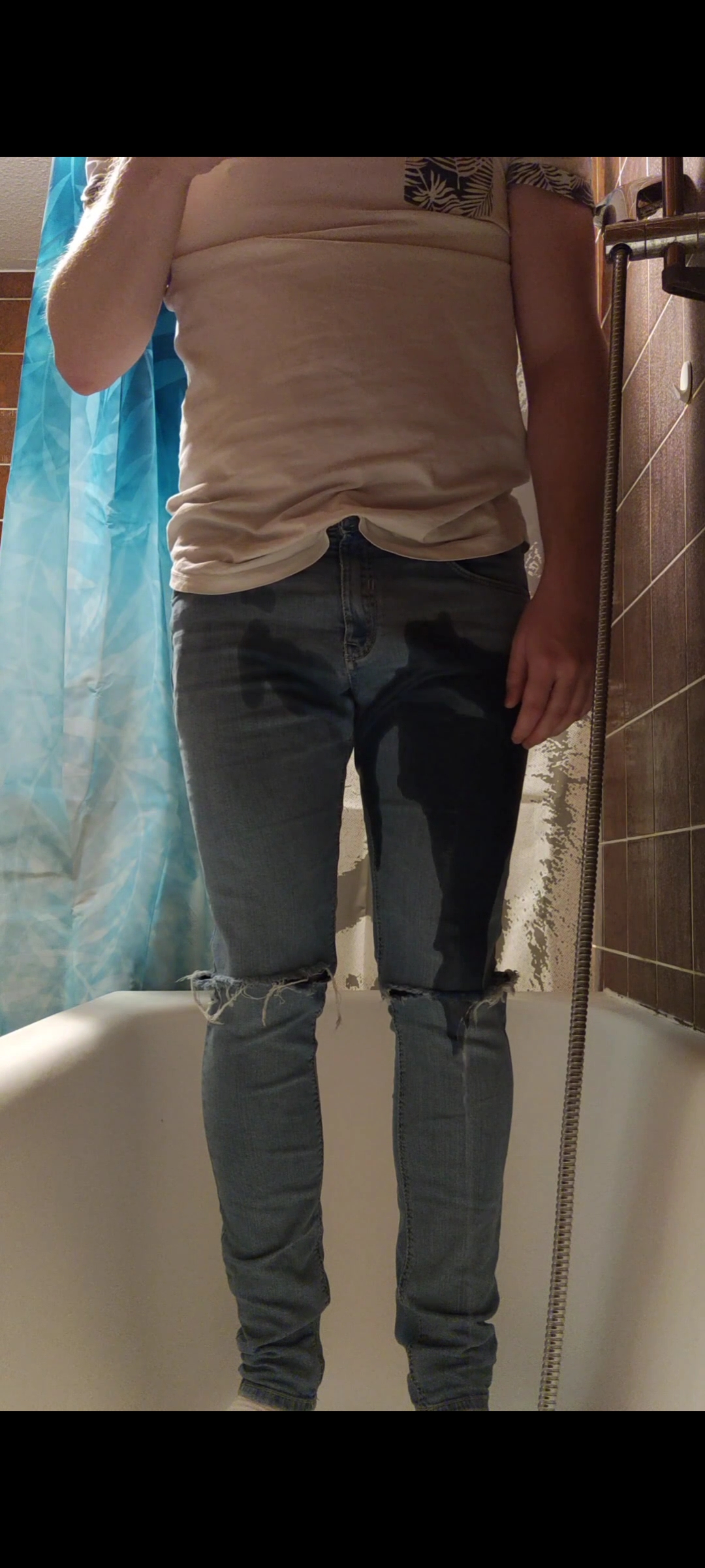 Desperate pee in blue jeans