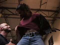 Long-haired man tied up in the garage