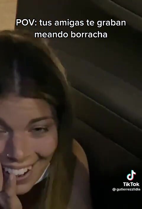 Spanish girl peeing next to car