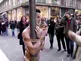 Italian guy taped to pole in underwear