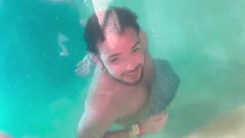 Underwater barefaced bearded merman in tank