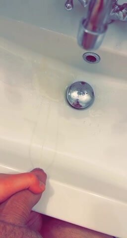 Pissing in to sink