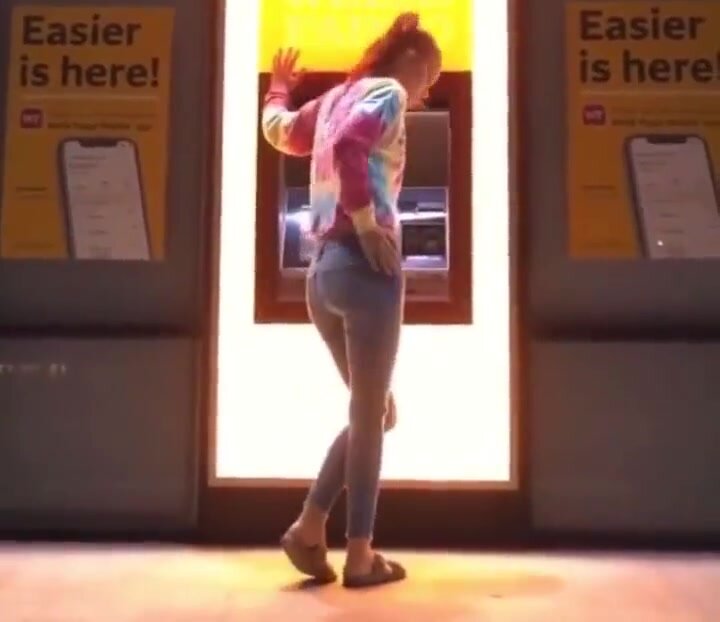Girl desperately loses control at an ATM