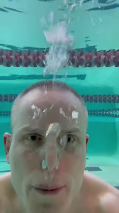 Underwater barefaced guy let all his air out
