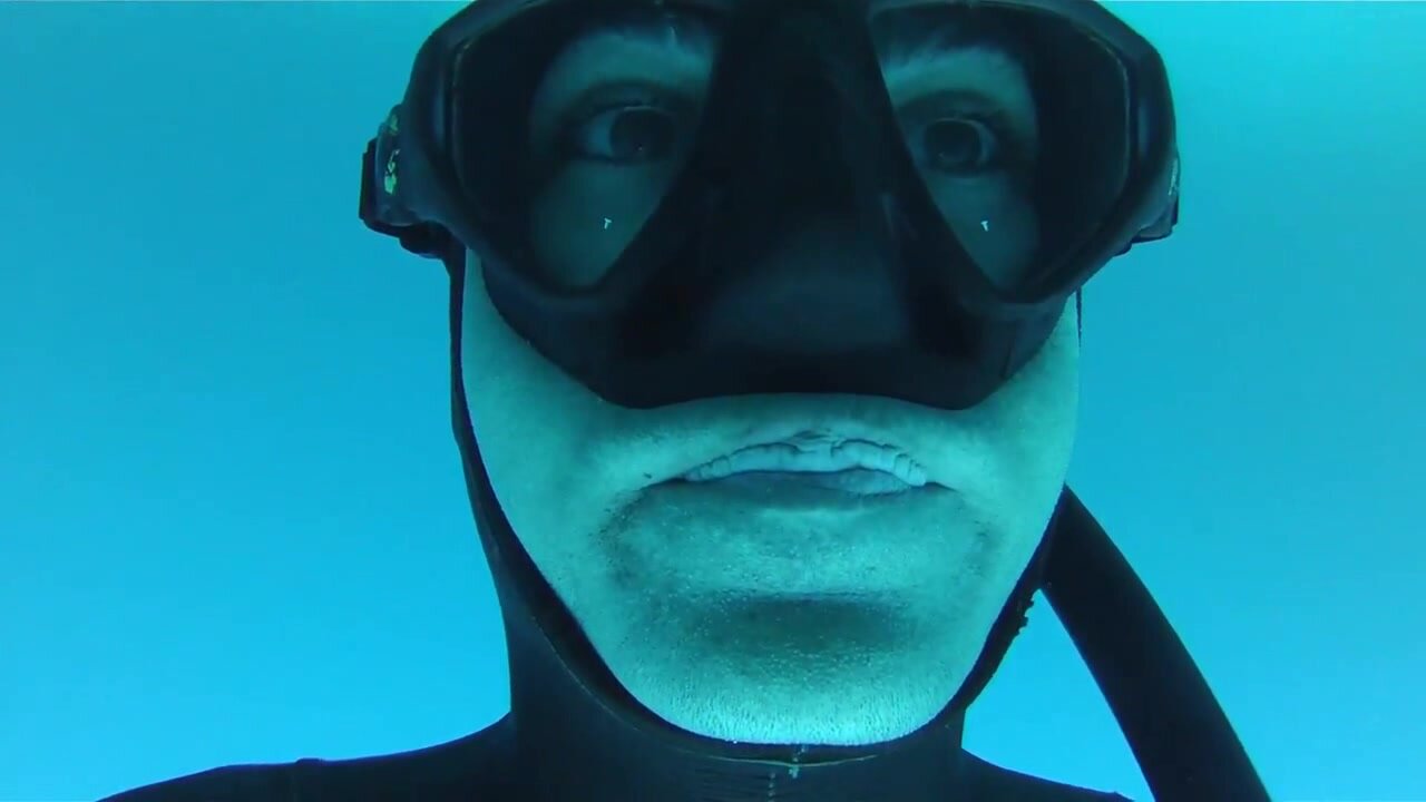 Underwater masked breathold closeup
