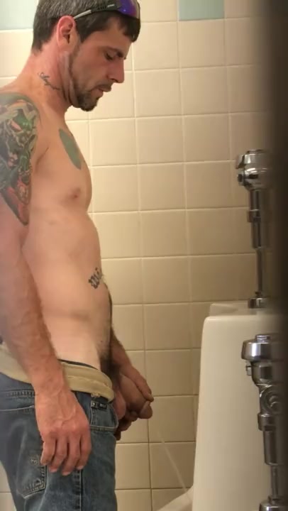 tattooed guy caught pissing