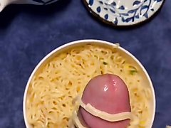Big dick playing with noodles and cum on it