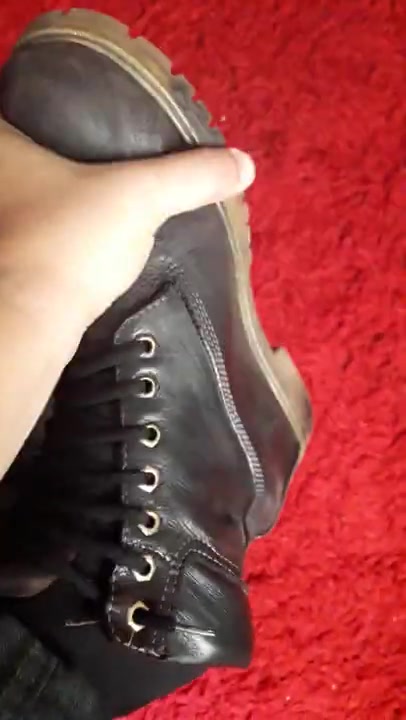 Stinky male feet with work boots