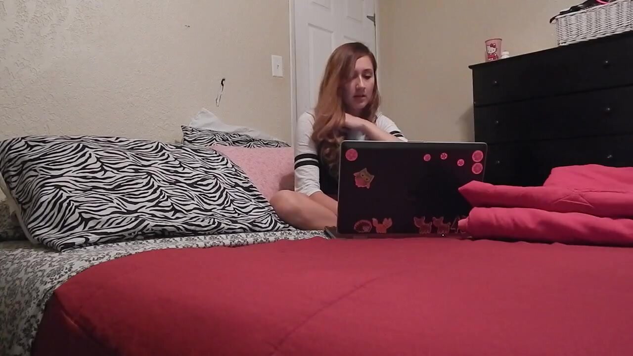 Young woman watches porn and masturbates