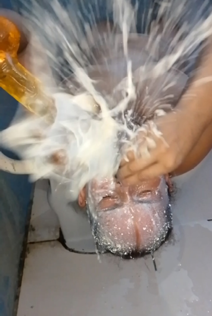 Shower of milk vomit in the face