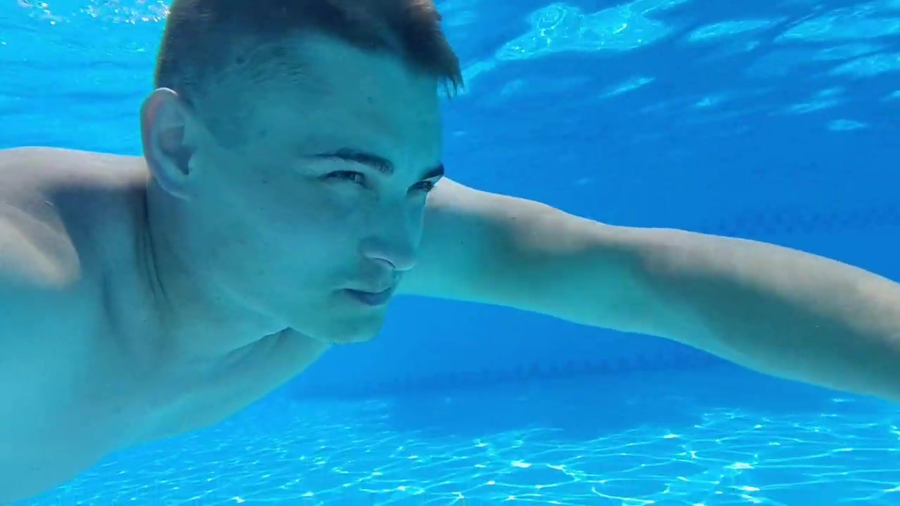 Russian hottie swimming barefaced underwater