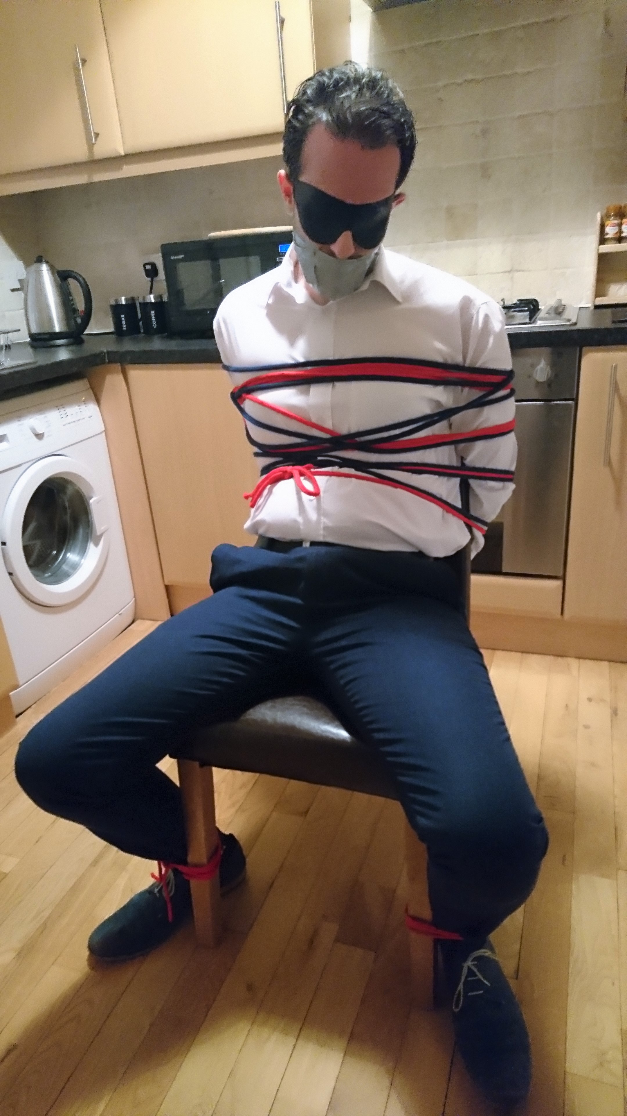 chairtied in shirt and trousers