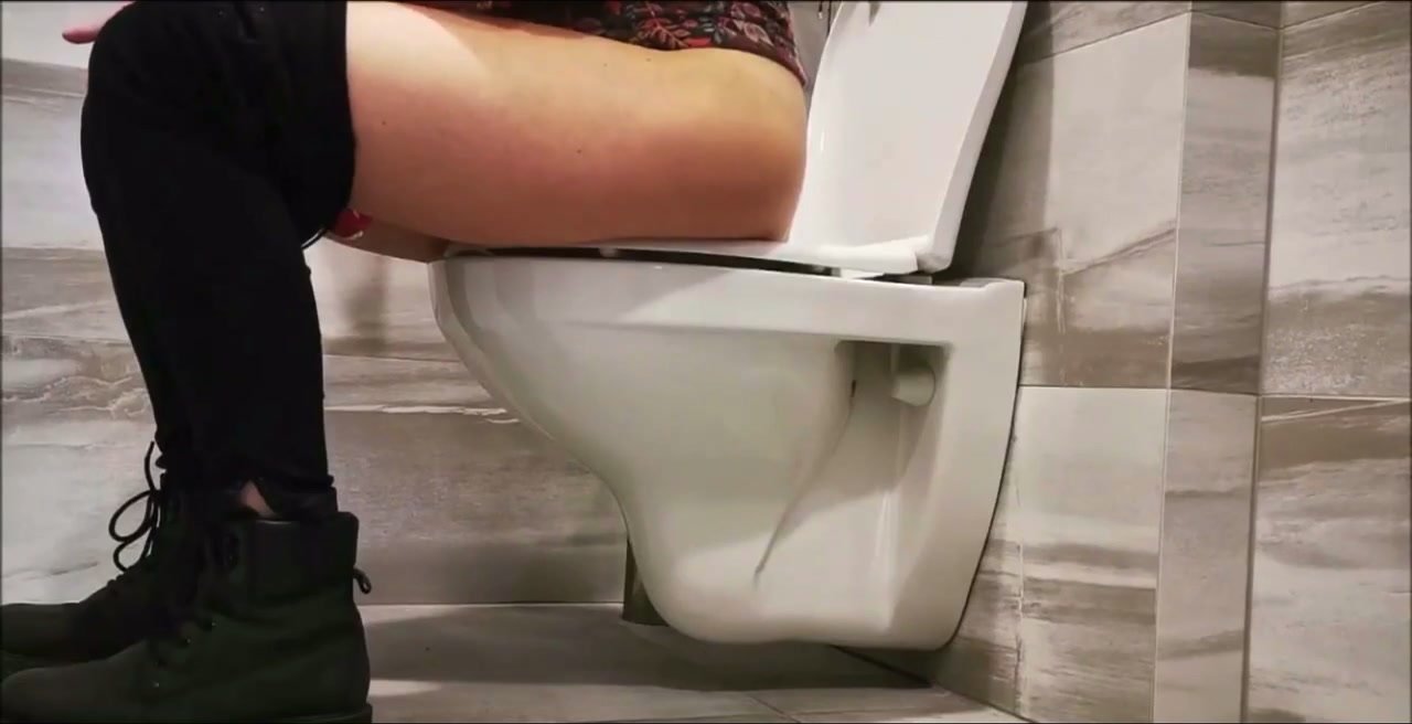 Women pooping on toilet