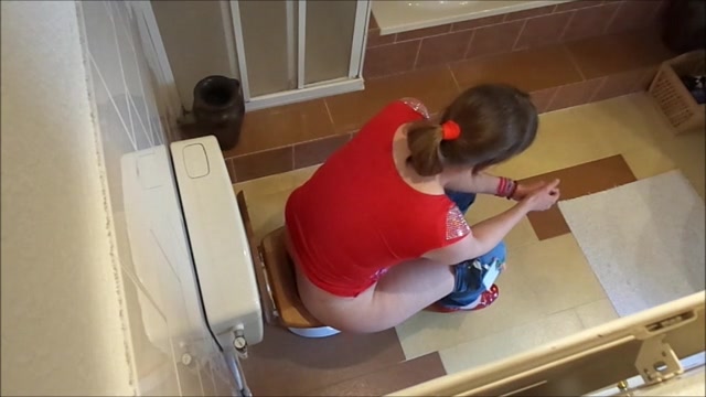 Latina pooping on toilet