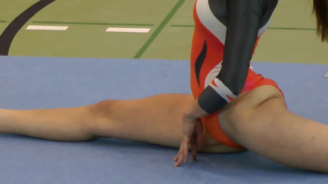Gymnast showing panties in orange leotard