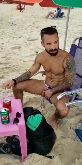 men pissing at the beach
