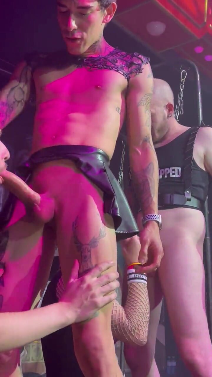 Guys having sex on stage at a party