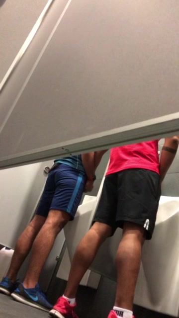 jerk each others at the urinals