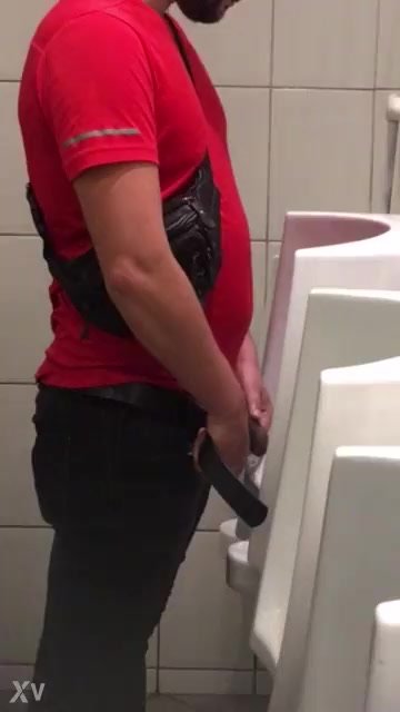 nice guy pissing at urinal