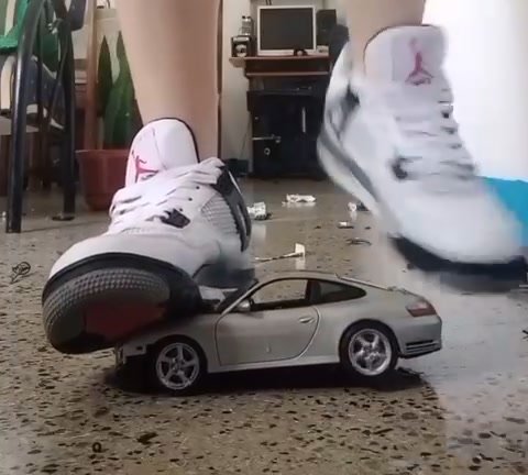 Stomping diecast model in Nike jordan - video 2