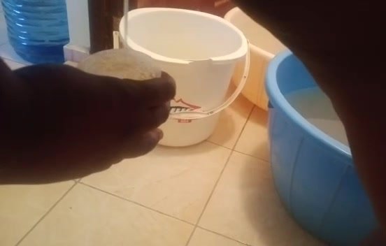 African girl drink cup of piss