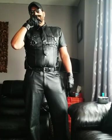 Leather daddy smoking.