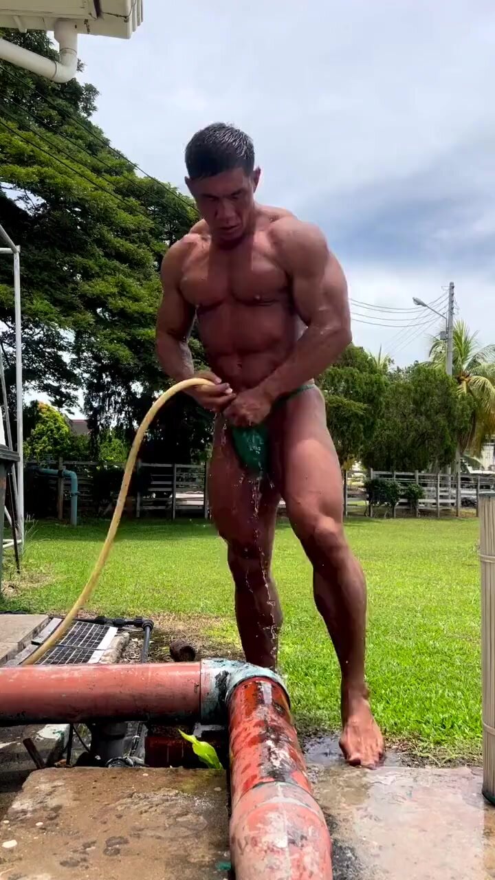 Shy muscle asian daddy washes his dick in public