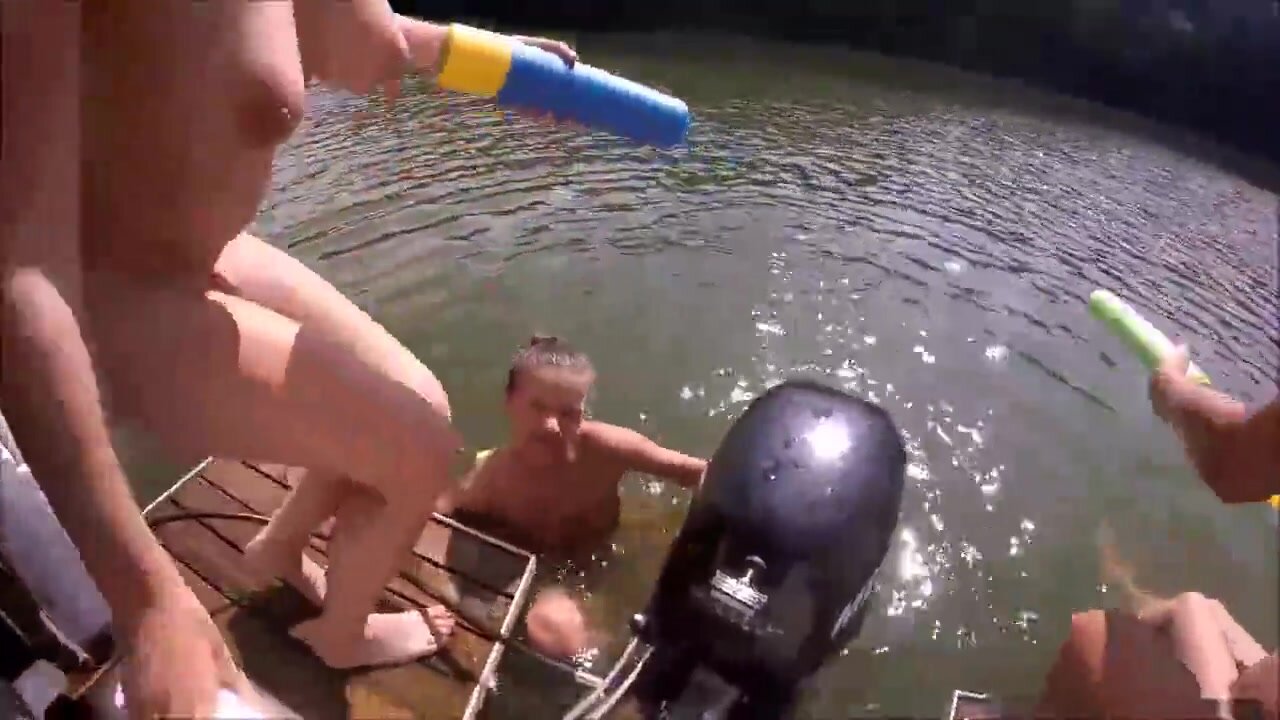 wild girls skinny dipping off of a boat