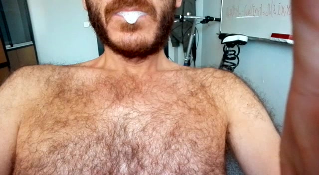 hairy guy drools & spits